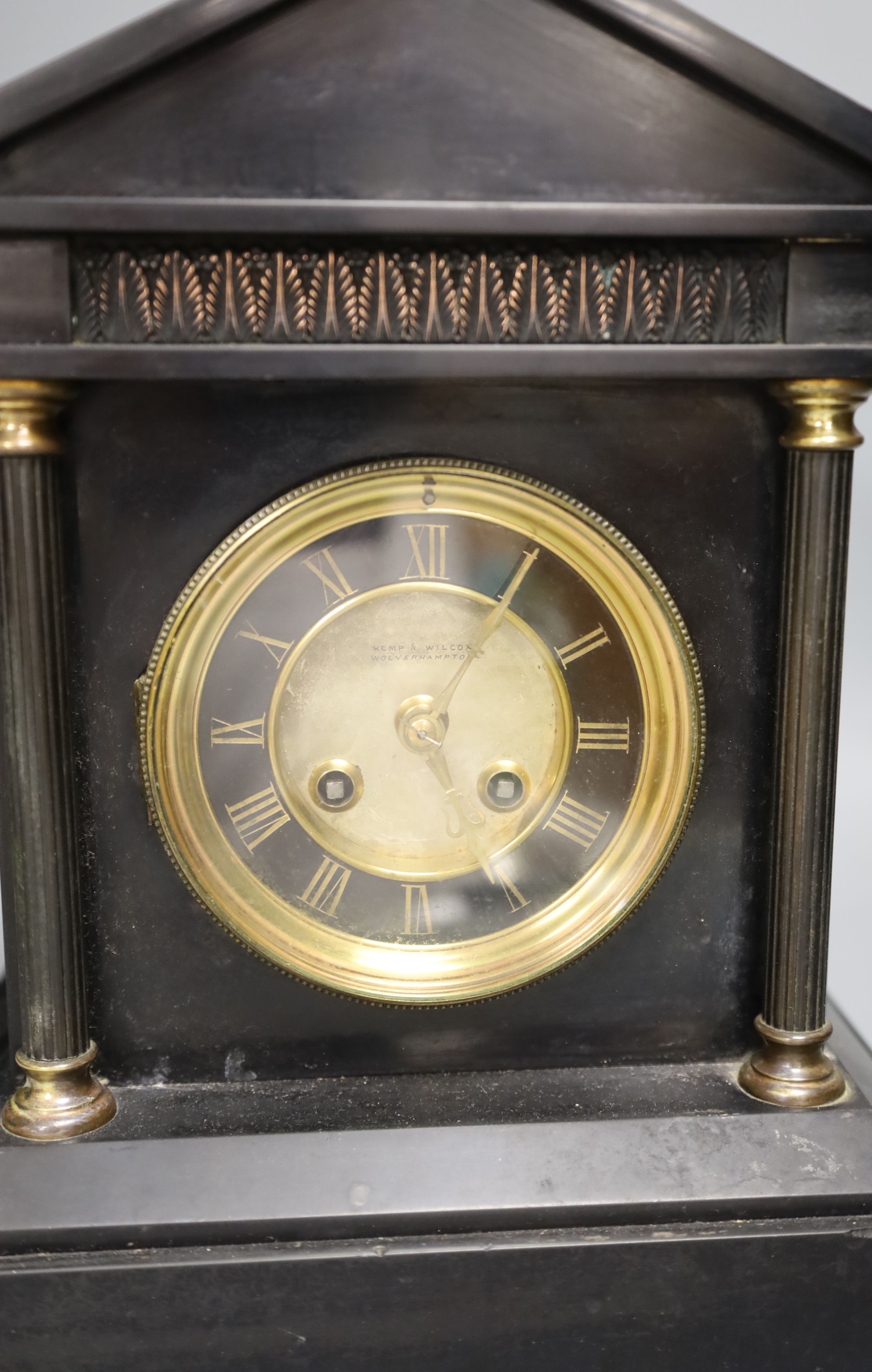 Kemp & Wilcox of Wolverhampton. A Victorian black slate mantel clock, height 31cm